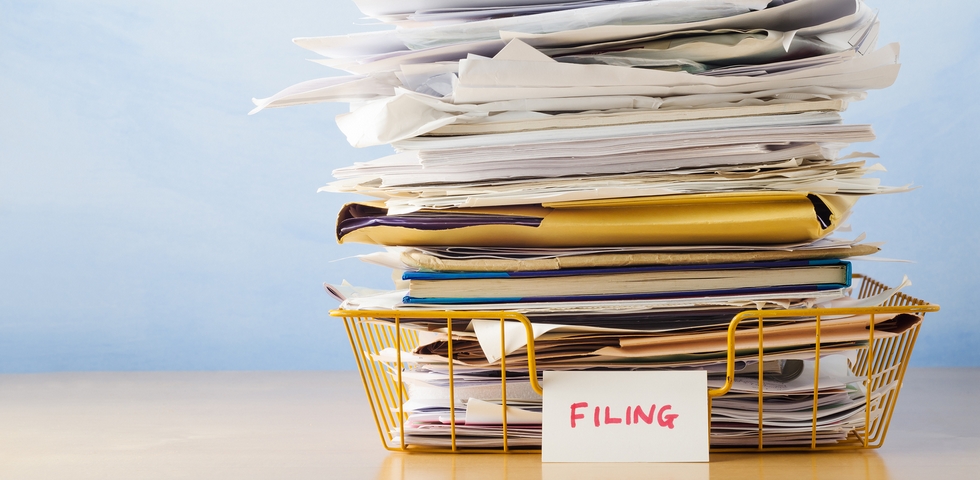 One of the office organization tips and tricks is to revise your filing system.