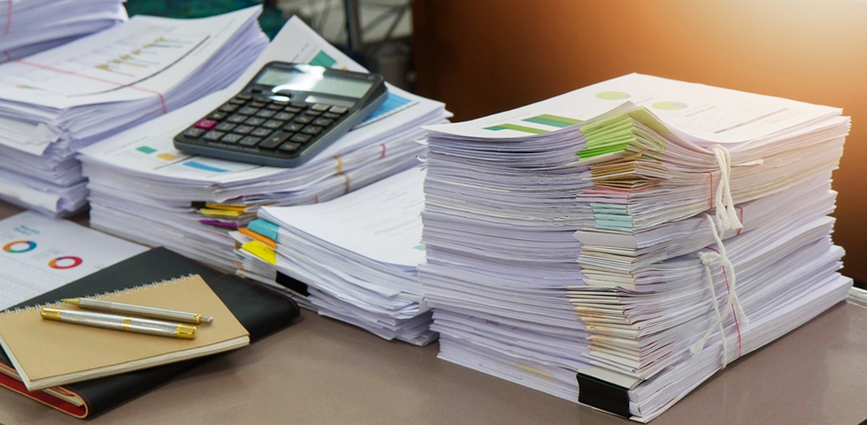 One of the office spring cleaning tips is to organize your paperwork.
