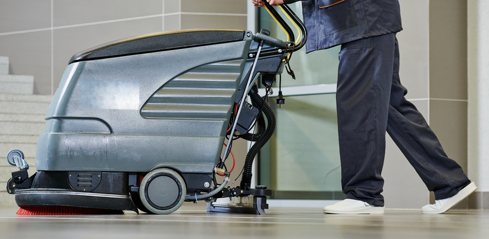 Use the right cleaning equipment to clean a warehouse floor.